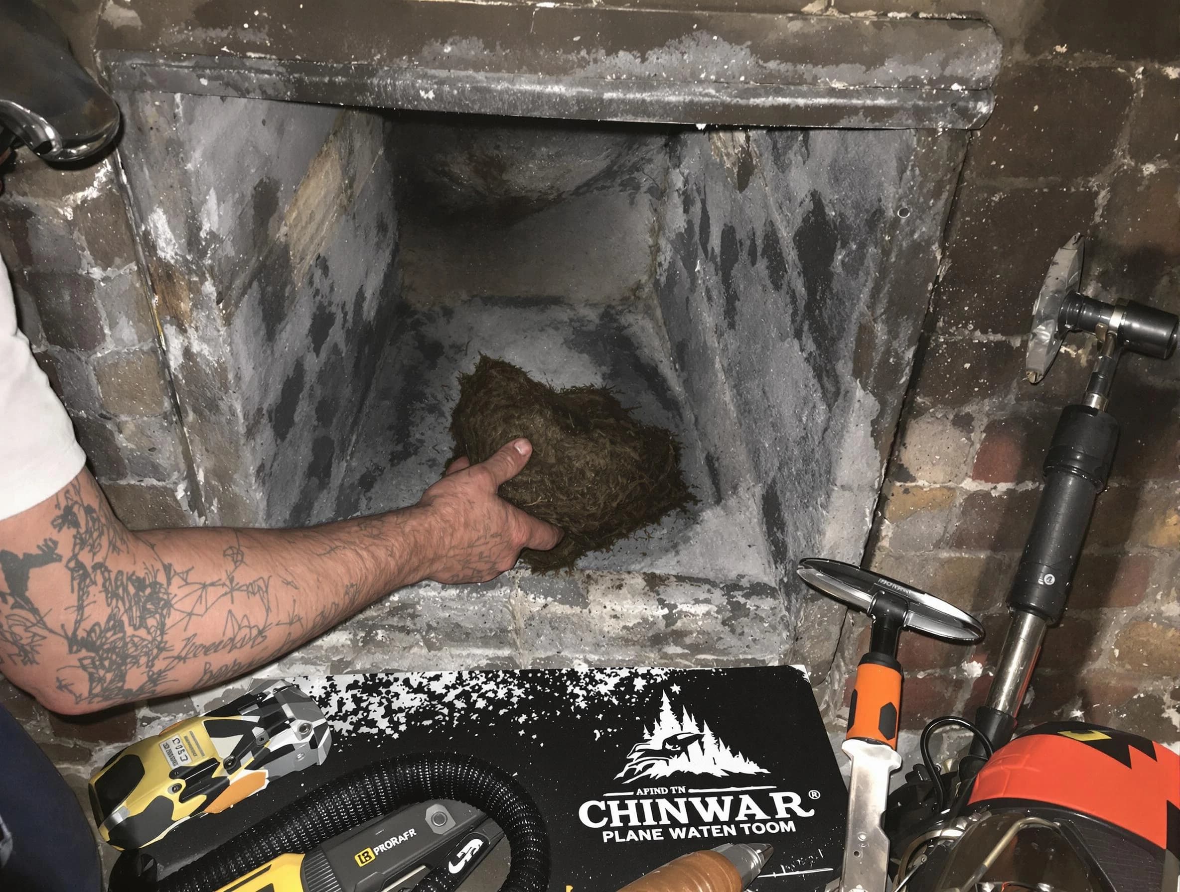 Toms River Chimney Sweep safely removing debris and screening chimney in Toms River, NJ